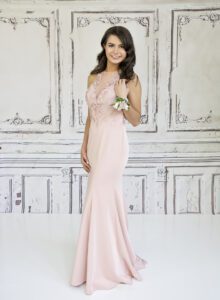 high school senior girl in soft pink prom dress